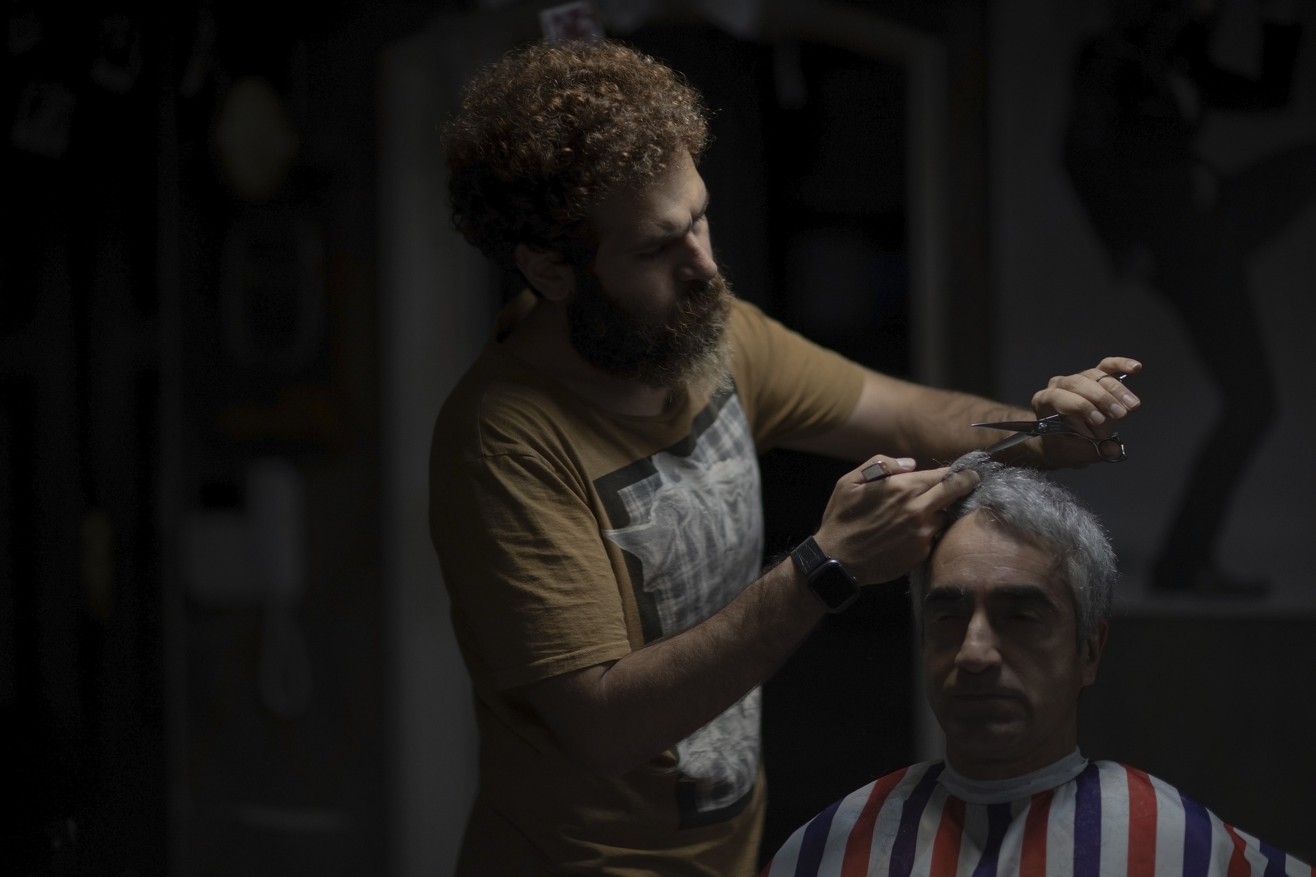 Man in chair getting a haircut